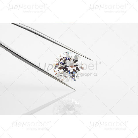 diamond in metal tongs
