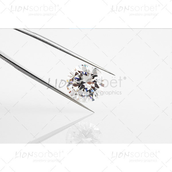 diamond in metal tongs