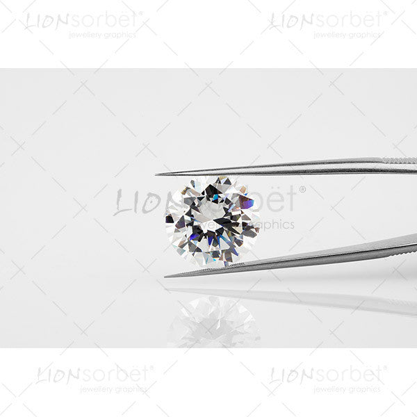 Round Diamond held in steel tongs