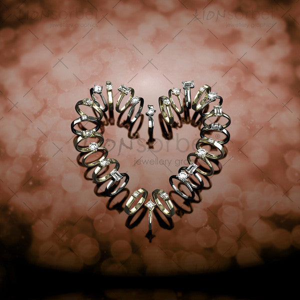 Image of engagement rings making a heart shape