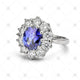 jewellery stock photograph of a blue sapphire and diamond cluster ring