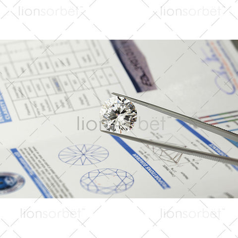 diamond in tweezers with certification